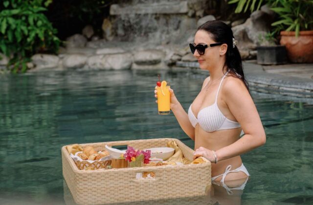 Luxury floating breakfast dining experience in the swimming pool at Astagina Resort Villa Bali.
