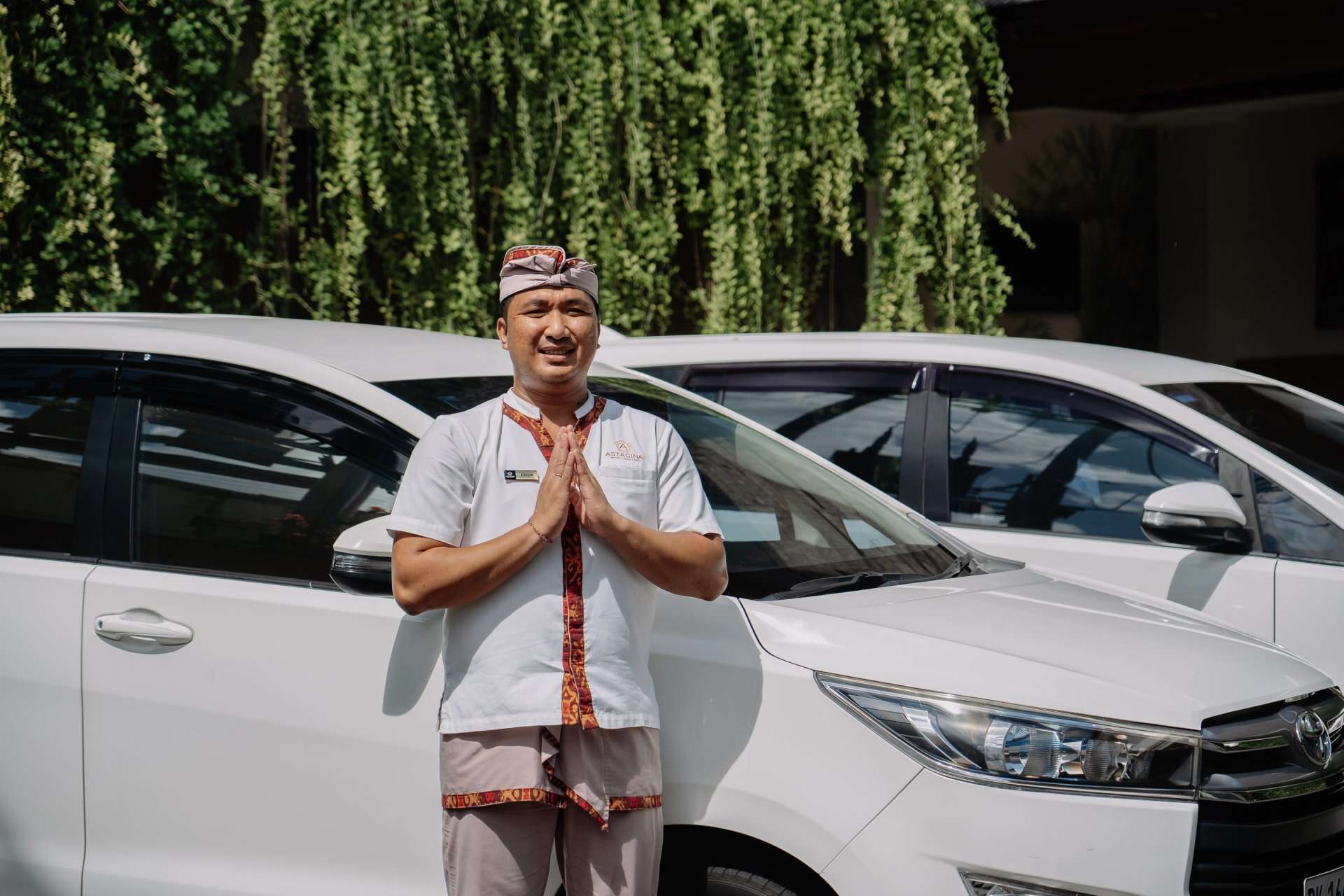 Astagina Resort staff offering a warm Balinese welcome to guests, supporting comfortable and seamless stays in Legian.