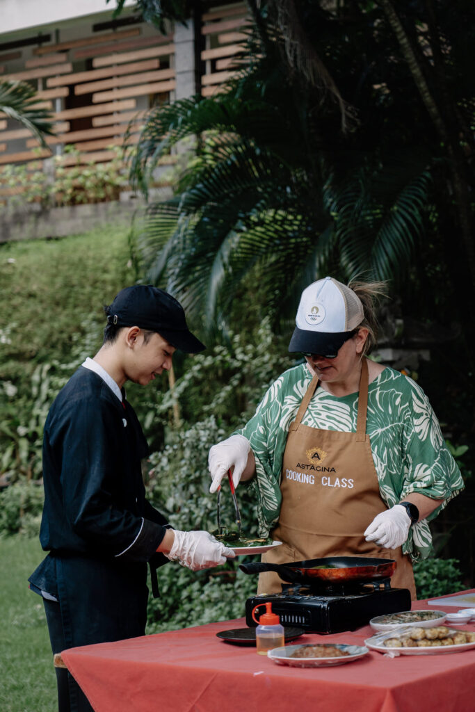 Cooking class experience in outdoor setting at Astagina Resort Villa and Spa Legian family resort Bali