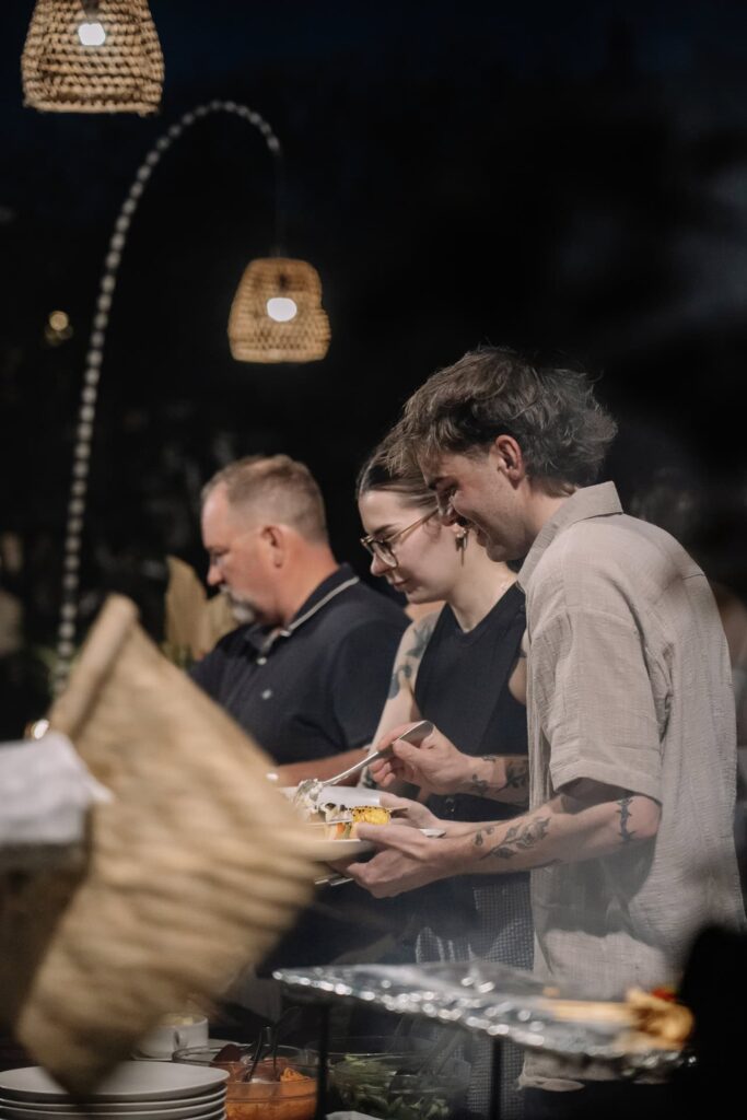 Guests enjoying casual dinner buffet experience during evening event at Astagina Resort Villa and Spa Legian