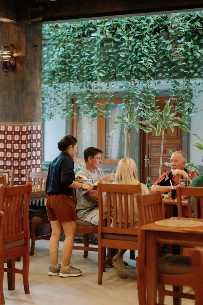 Happy Family Having Dinner at Astagina Resort Villa and Spa Legian